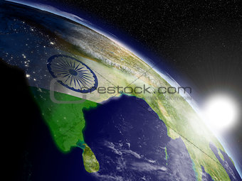 Sunrise over India with flag