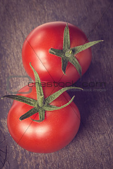 fresh tomatoes on wood table
