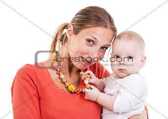 Young Caucasian woman and baby boy playing with nursing necklace over white