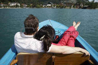 young couple boating on the lake