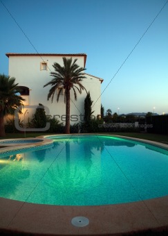 Villas with swimming pool by night
