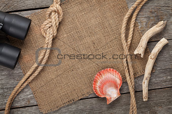 Ship rope with burlap on old wooden texture background
