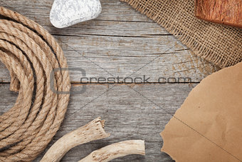 Ship rope on old wooden texture background
