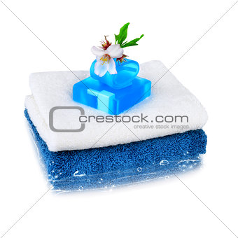 White and blue towels with blue soap