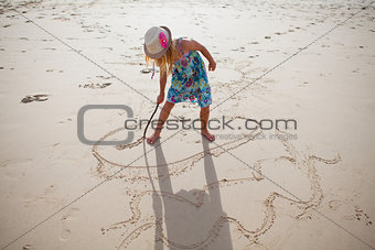 Young girl playing on beach