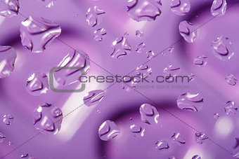 violet abstract background with water drops