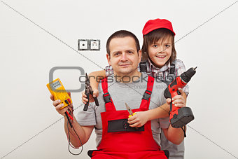 Working with dad - happy boy helping his father