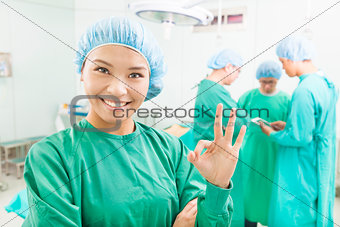 surgeons finish the operation and thumb up 