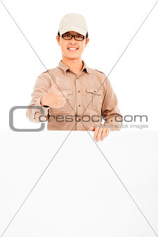 confident delivery man holding white board and thumb up