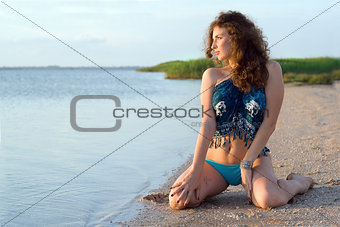Young woman sitting on the bay