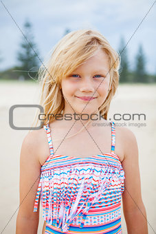 Young cute girl at the beach