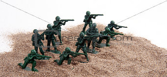 Toy Army Men in Pile of Sand