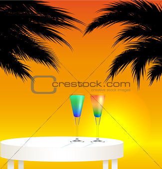 Tropical trip concept ; sunset landscape with two cocktails