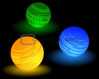 three multi-colored ball
