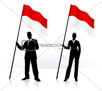 Business silhouettes with waving flag of Monaco