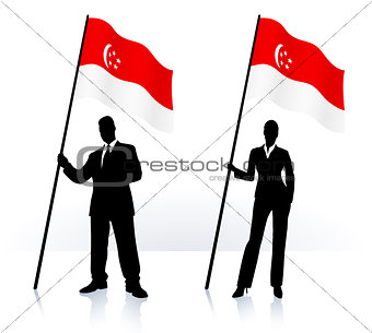 Business silhouettes with waving flag of Singapore