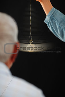 Senior man undergoing hypnotherapy treatment