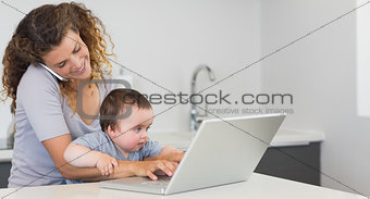 Young woman multi tasking at home