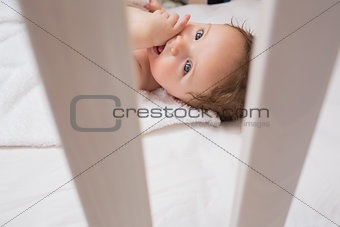 Lovely baby with finger in mouth