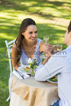 Couple drinking champagne at outdoor café