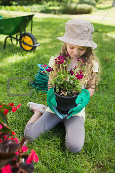 Little girl engaged in gardening