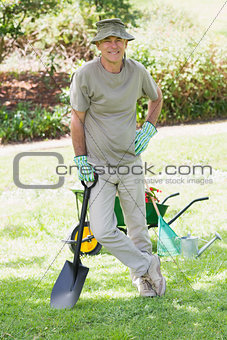 Male gardener with spade at garden
