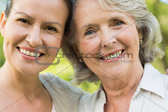 Smiling mature woman with adult daughter