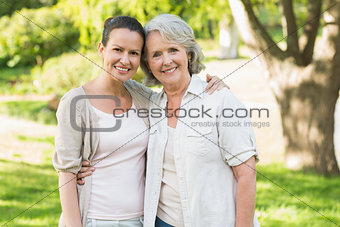 Portrait of a mature woman with daughter at park