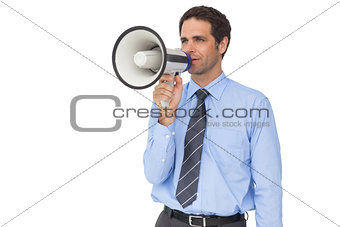 Handsome businessman talking through megaphone