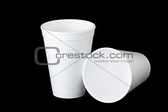 two styrofoam cups on black