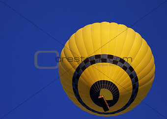 Hot air balloon on blue clear sky