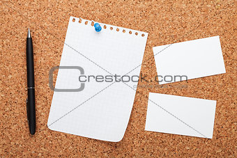 Blank notepad paper, business cards and pen