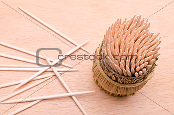 Wooden toothpicks from above on a cutboard