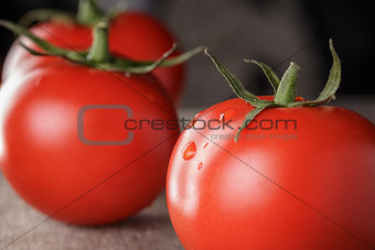 fresh ripe tomatoes on wooden table