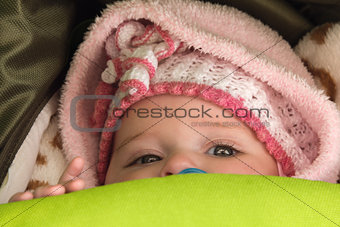 baby girl in pink warm clothes