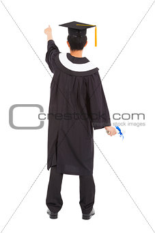  graduation man wearing a mortarboard and pointing somewhere