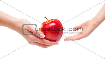 Woman giving apple to children