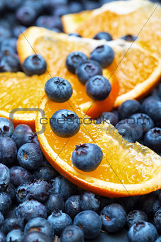 Freshly picked blueberries with orange