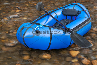 packraft with a paddle