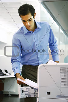 worker using a copy machine