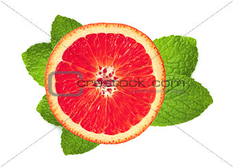 fresh grapefruit slice and leaves of mint isolated on white