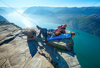 Happy family on  Preikestolen massive cliff top (Norway)