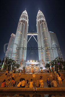 Tourists by Petronas Twin Towers at Night