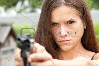 Handgun Range Shooting Practice by Angry Looking Female
