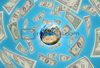 Earth on blue background. Money falling around