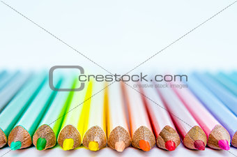 Close up detail of colorful pencils with white background