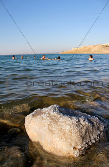 Dead Sea coastline, whit salt crystals and formations in the san