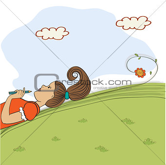 bored young girl lying on grass