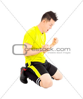 young soccer player make a fist and  yell