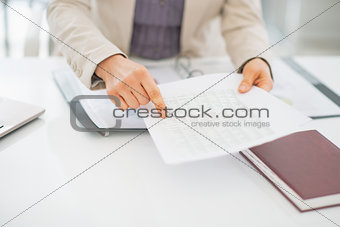 Closeup on business woman pointing on document
